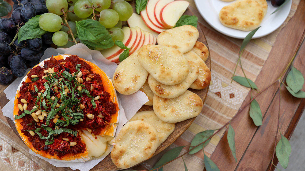 Sundried Tomato Pesto Baked Brie with Parmesan Olive Oil Naan Dippers®