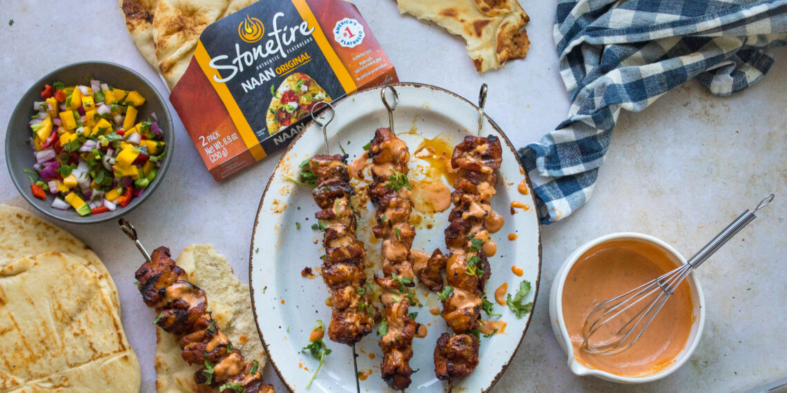 Enjoy a delightful Bang Bang Chicken with Grilled Stonefire® Naan and Mango Salsa. This recipe combines spicy chicken, warm Stonefire naan, and fresh mango salsa for a delicious meal.