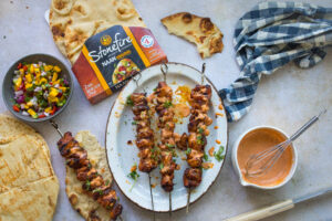 Enjoy a delightful Bang Bang Chicken with Grilled Stonefire® Naan and Mango Salsa. This recipe combines spicy chicken, warm Stonefire naan, and fresh mango salsa for a delicious meal.